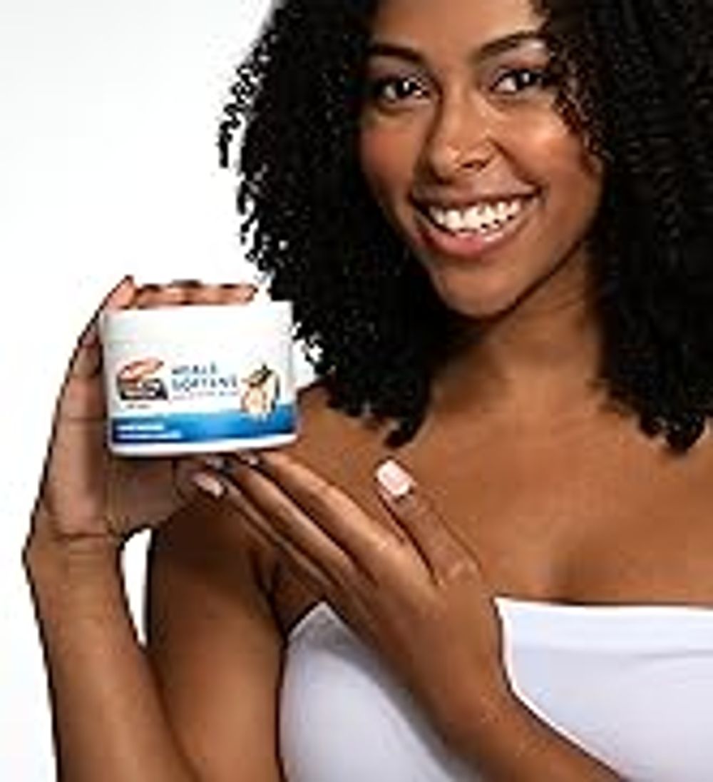 cocoa butter balm solid lotion in model's hand